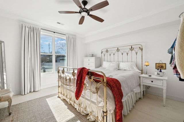 bedroom featuring ceiling fan and crown molding