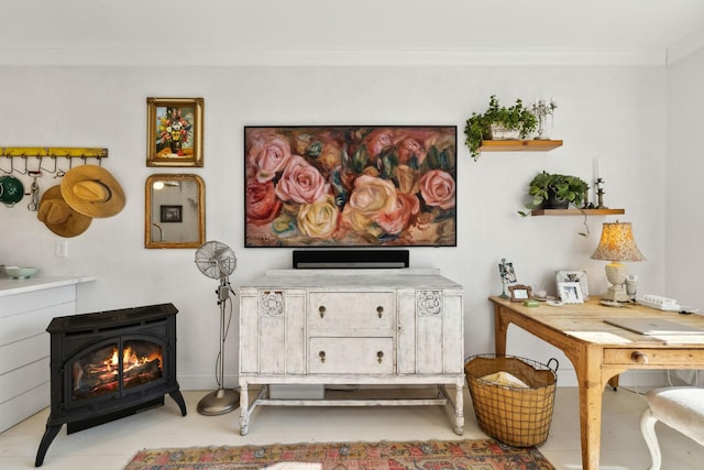 interior space featuring a wood stove and ornamental molding