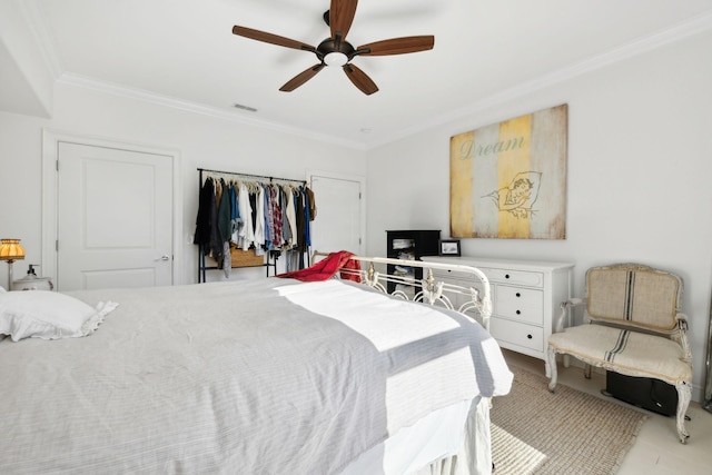 bedroom with ceiling fan and ornamental molding