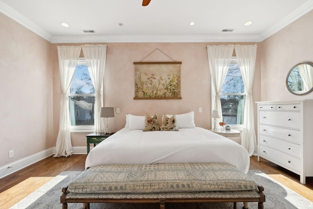 bedroom featuring hardwood / wood-style floors and ornamental molding