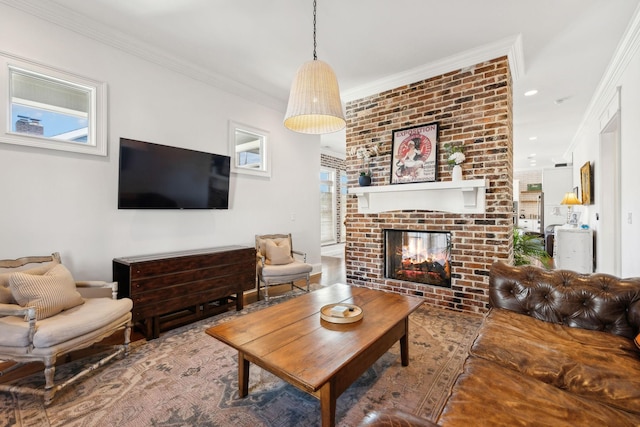 living room featuring crown molding and a brick fireplace