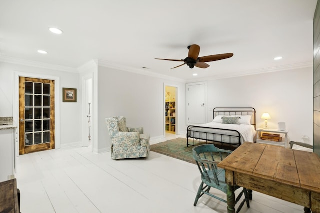 bedroom with a spacious closet, a closet, ceiling fan, and ornamental molding