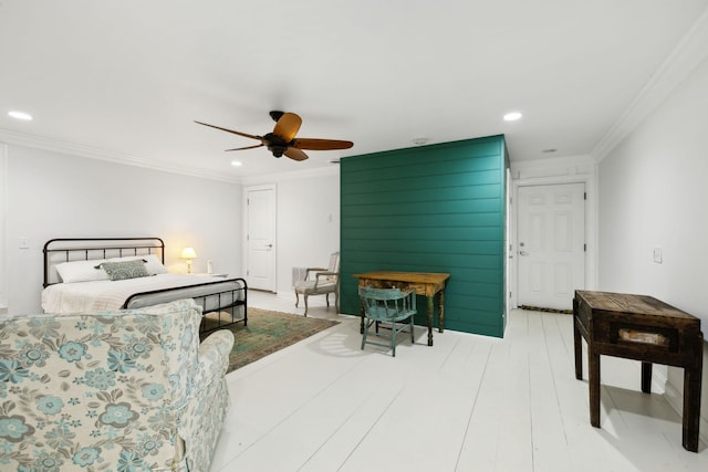 bedroom with ceiling fan and ornamental molding