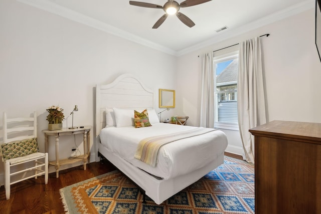 bedroom featuring ceiling fan, dark hardwood / wood-style flooring, and ornamental molding