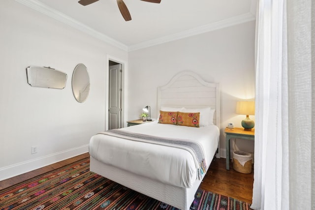 bedroom featuring dark hardwood / wood-style floors, ceiling fan, and ornamental molding