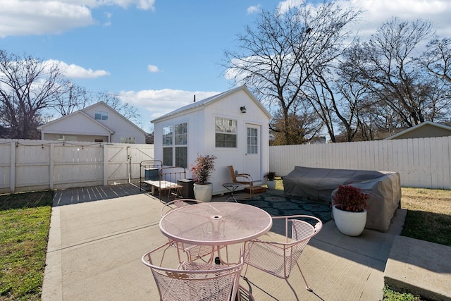 view of patio / terrace with an outbuilding