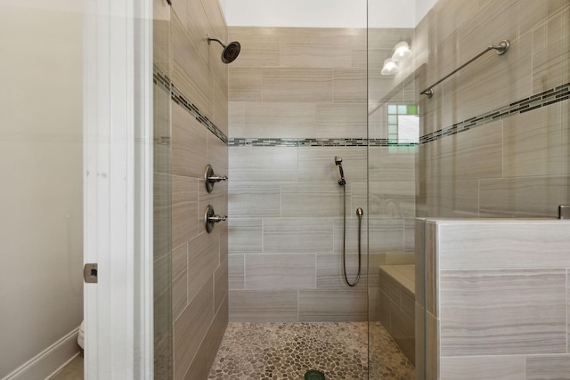 bathroom featuring tiled shower