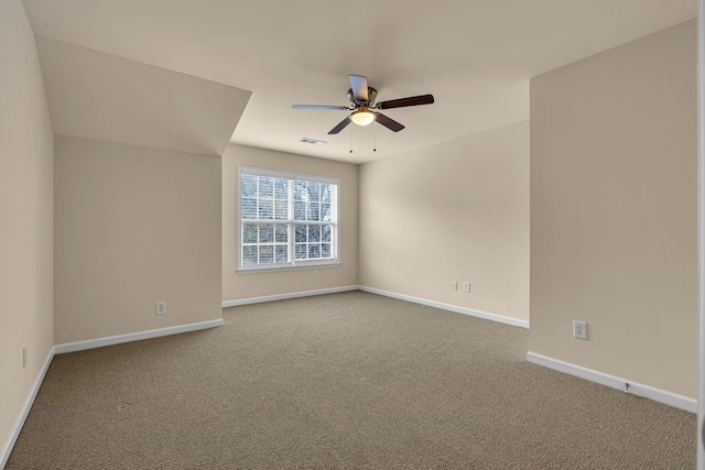 carpeted empty room featuring ceiling fan