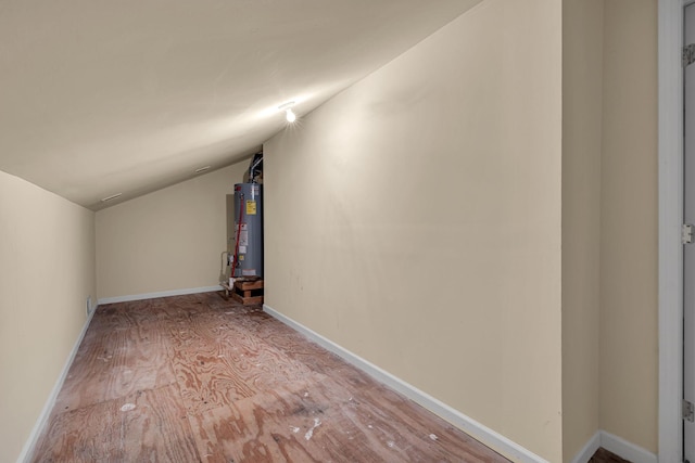 bonus room featuring gas water heater and lofted ceiling