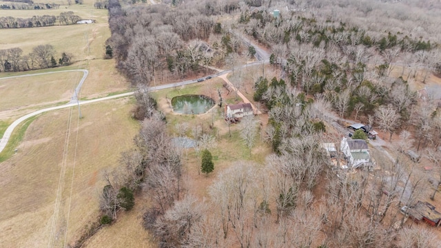 birds eye view of property featuring a water view and a rural view