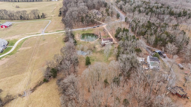 birds eye view of property with a water view and a rural view