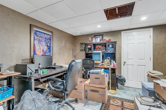 office area with a drop ceiling