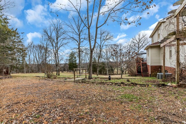 view of yard featuring central AC unit