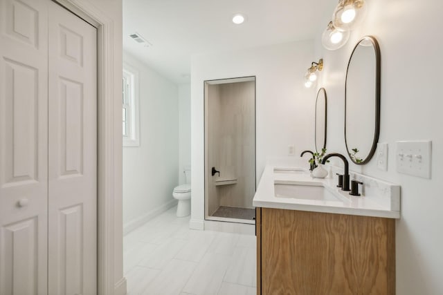 bathroom with tile patterned floors, vanity, and toilet