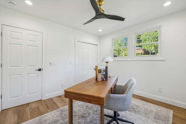 office space with hardwood / wood-style floors and ceiling fan