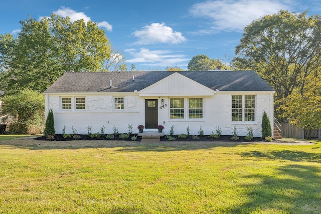 ranch-style house featuring a front lawn