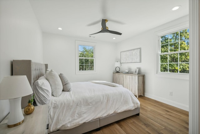 bedroom featuring ceiling fan and hardwood / wood-style floors