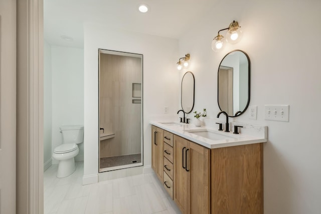 bathroom featuring tile patterned floors, vanity, and toilet