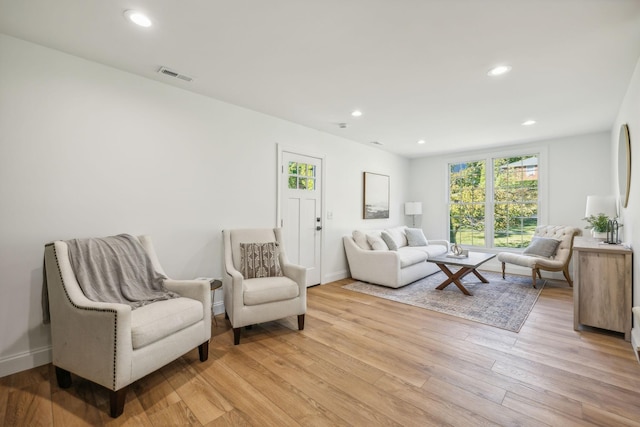 living room with light hardwood / wood-style flooring