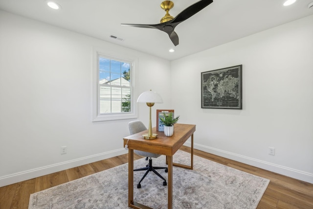 office space with hardwood / wood-style flooring and ceiling fan