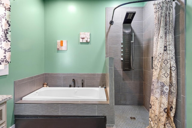 bathroom featuring plus walk in shower and vanity