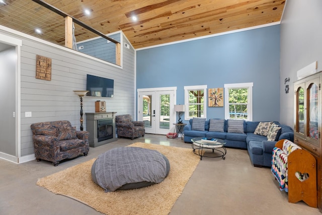 living room featuring plenty of natural light, wood ceiling, a high ceiling, and french doors