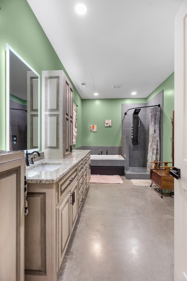 bathroom with concrete flooring, vanity, and separate shower and tub