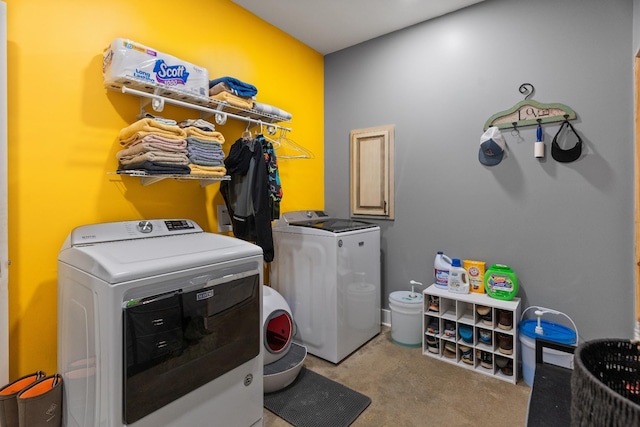 washroom featuring separate washer and dryer and light carpet