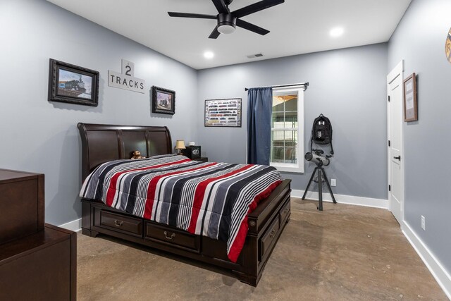 bedroom featuring ceiling fan and concrete flooring