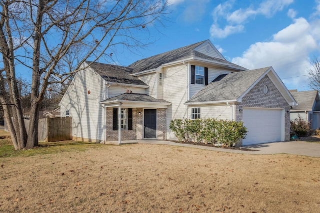 front facade with a garage and a front lawn