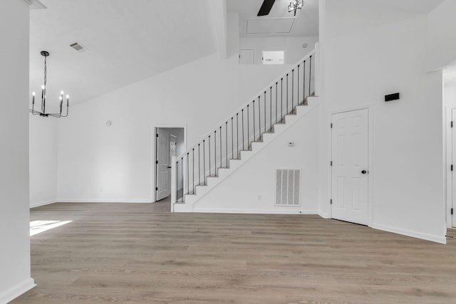 interior space featuring high vaulted ceiling and light wood-type flooring