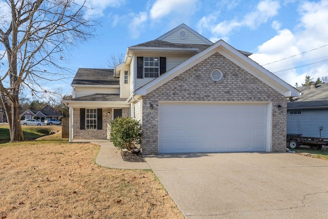 view of front property with a garage and a front lawn