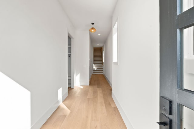 corridor featuring light hardwood / wood-style floors