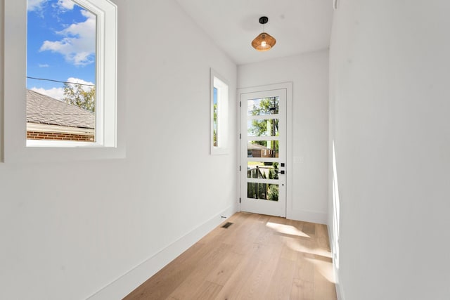 doorway to outside featuring light hardwood / wood-style floors