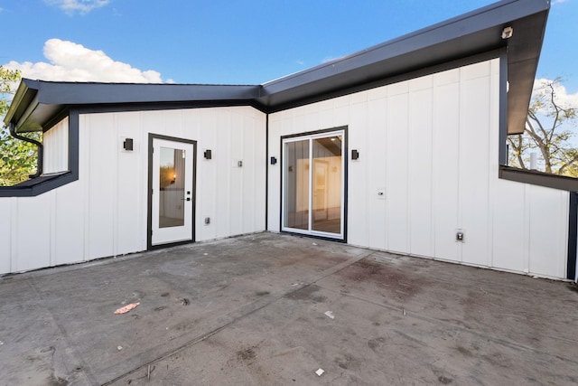 rear view of property featuring a patio area