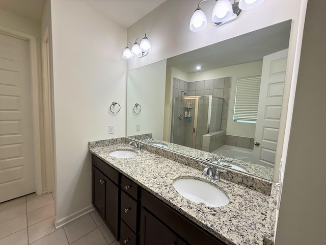 bathroom with tile patterned flooring, vanity, and plus walk in shower