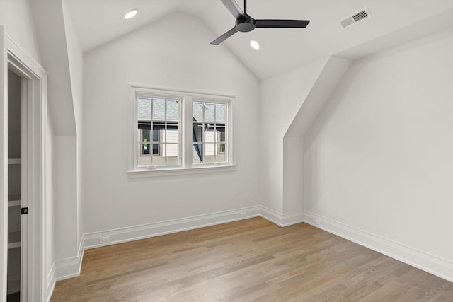 bonus room featuring vaulted ceiling, light hardwood / wood-style flooring, and ceiling fan