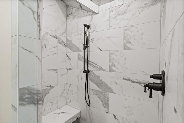 bathroom featuring tiled shower