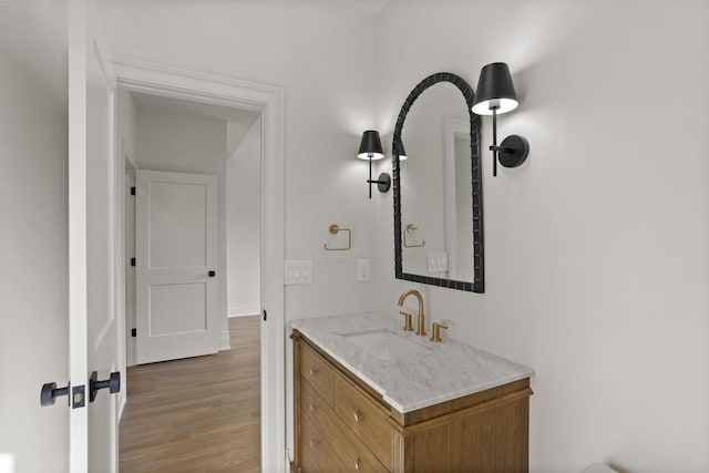 bathroom with vanity and wood-type flooring