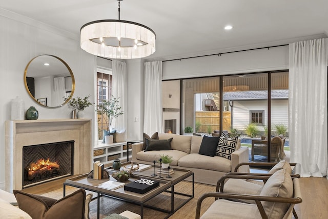 living room featuring a chandelier and hardwood / wood-style flooring