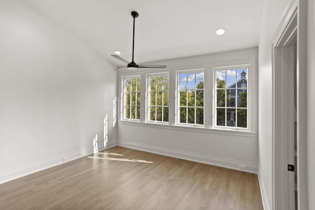 interior space with a wealth of natural light, ceiling fan, and lofted ceiling