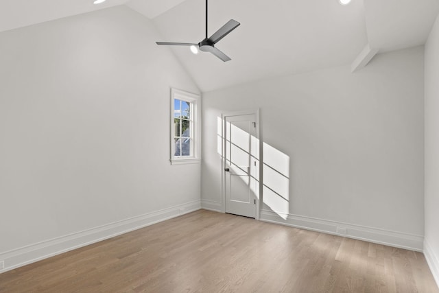 unfurnished room featuring ceiling fan, light hardwood / wood-style floors, and vaulted ceiling