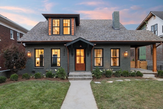 view of front of home with a lawn