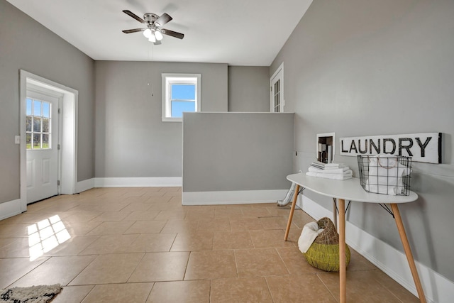 tiled foyer featuring ceiling fan