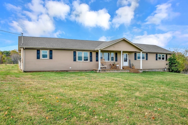 ranch-style house with a porch and a front lawn