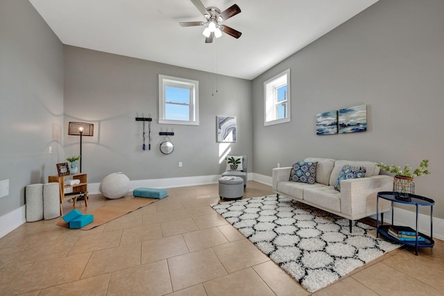 tiled living room with ceiling fan