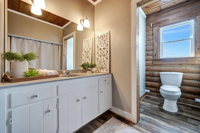 bathroom with vanity, wooden ceiling, hardwood / wood-style flooring, toilet, and log walls