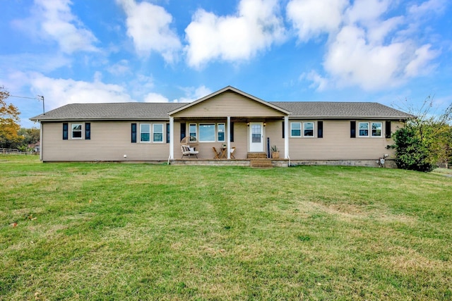 ranch-style home with a porch and a front yard