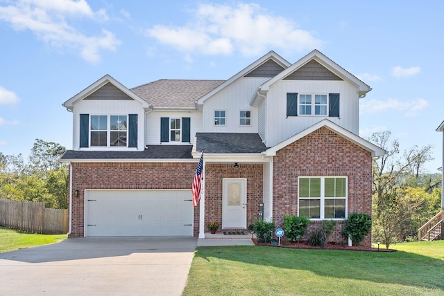 view of front of house with a front yard and a garage