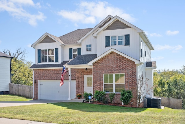 view of front of property with central AC unit, a garage, and a front lawn